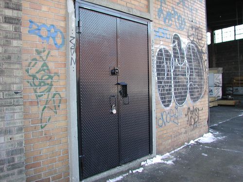 Solid metal diamond-plate security door.