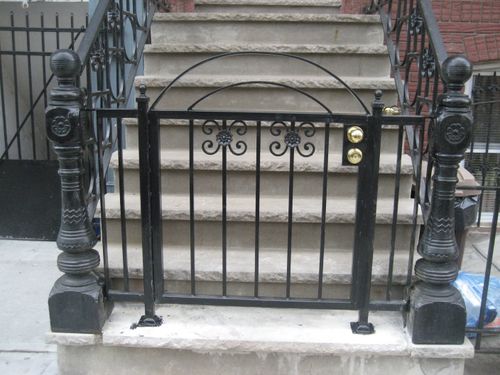 Metal railings and security gate for residential apartment building.