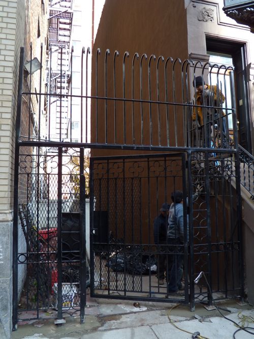 Security door with expanded metal screen on both sides and above.