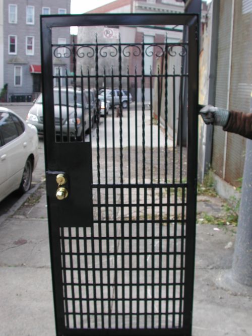 Metal security bar with vertical iron bars.