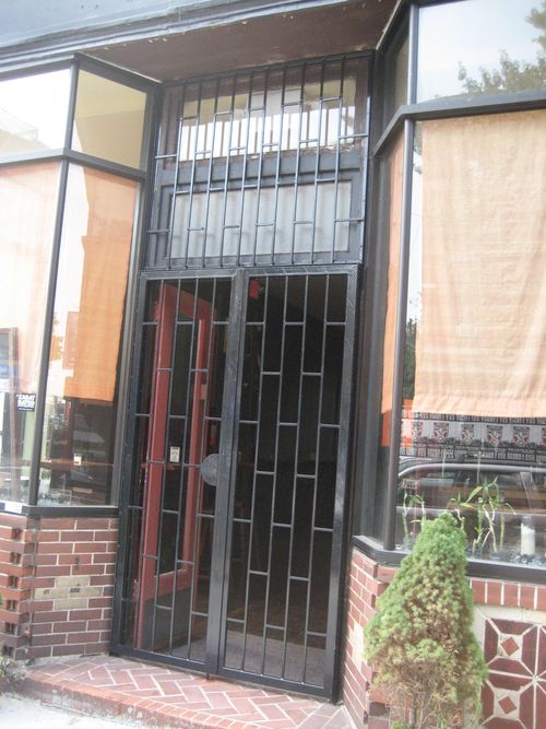 Commercial security door bars at entrance.