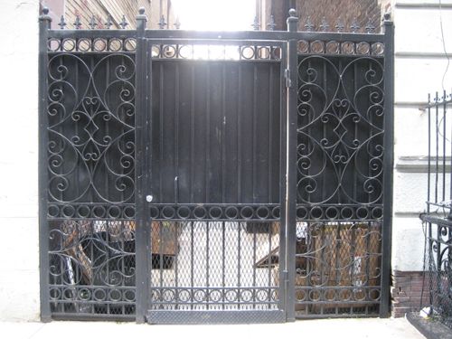 Metal security door for NYC building alley entrance.