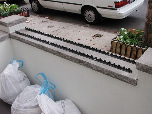 Decorative metal strips for flat street level surfaces.