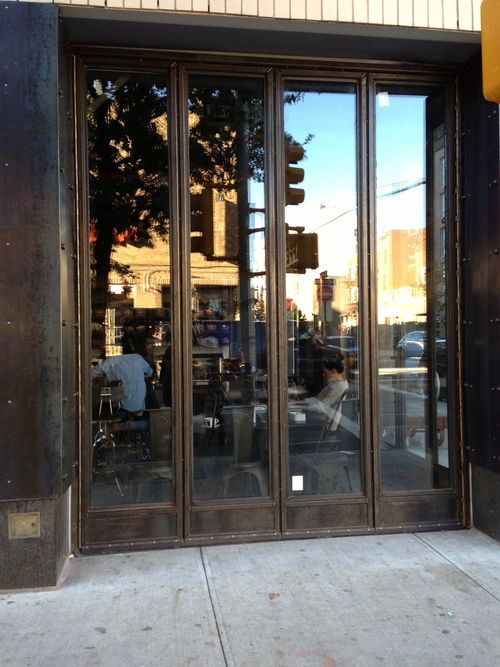 DG153 Bifold double door with a slim-profile aluminum frame, reinforced hinges, and a track mechanism, allowing for smooth folding operation