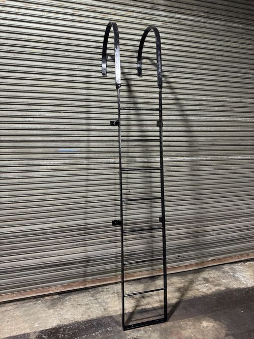 ST029 Custom-fabricated fixed steel ladder with curved mounting hooks and welded rungs