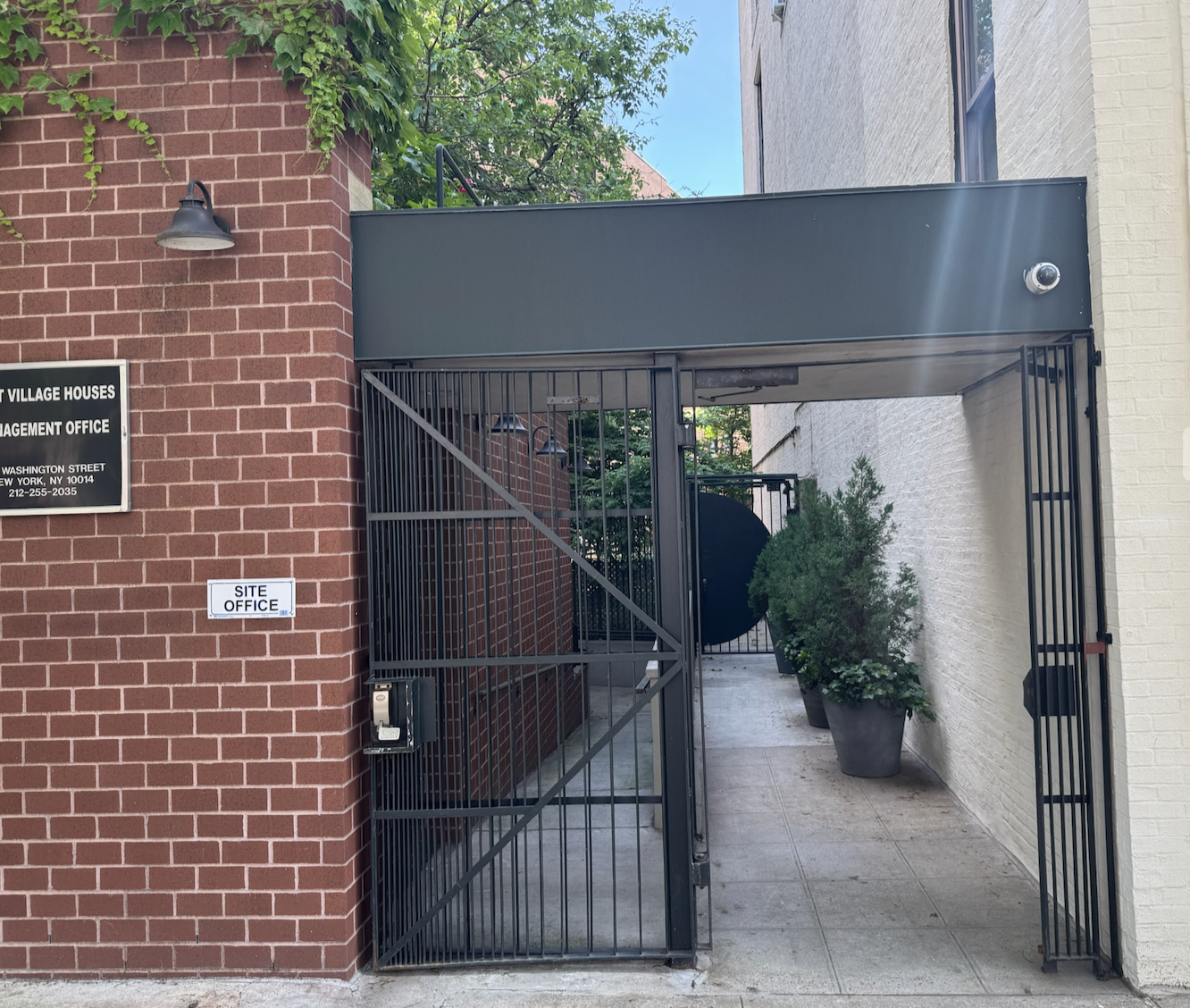 DG173 Entrance gate with narrow vertical pickets, a diagonal structural brace, and an integrated lock housing