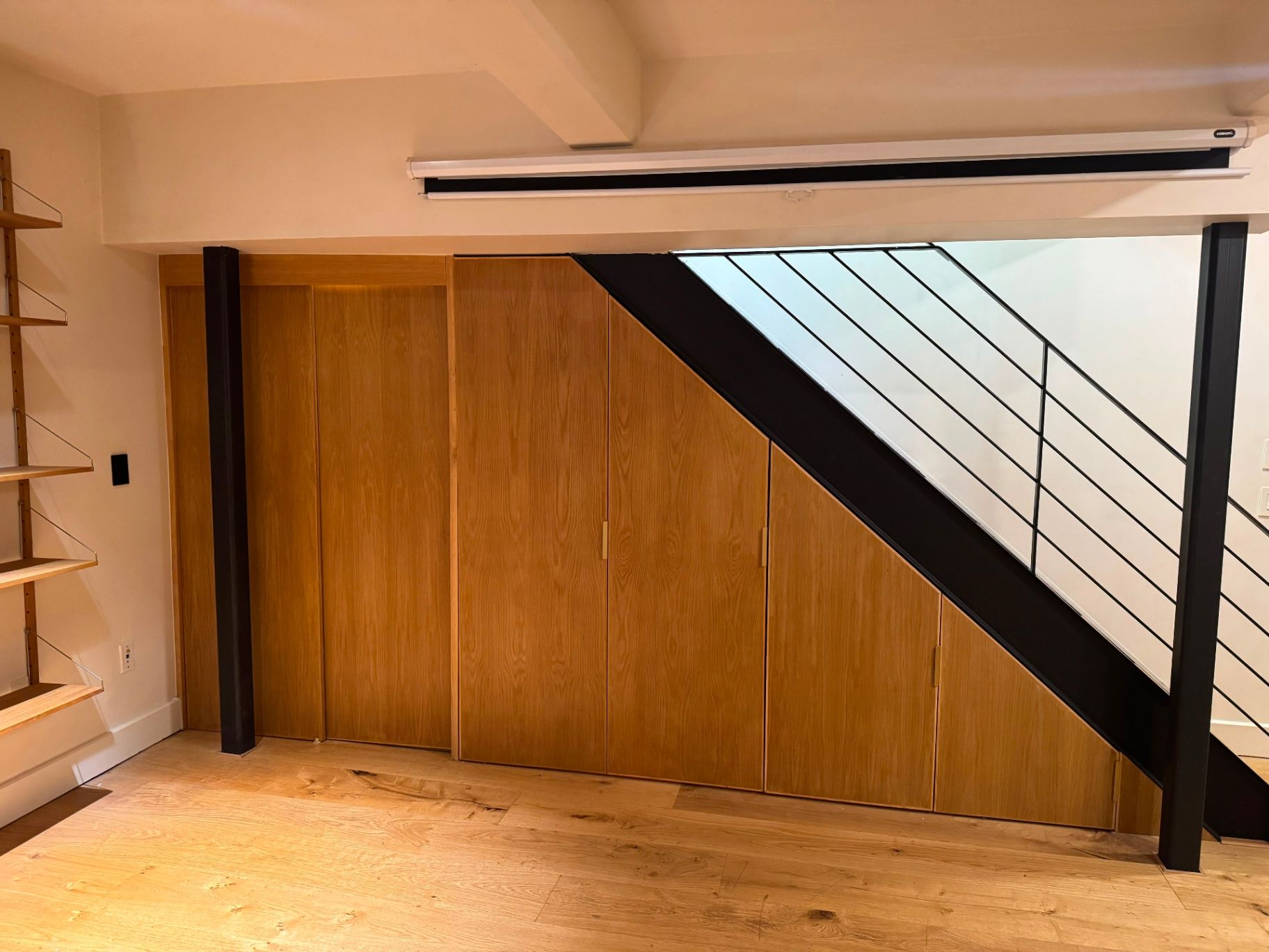 Second after view of the restored custom millwork showing seamless color and grain continuity