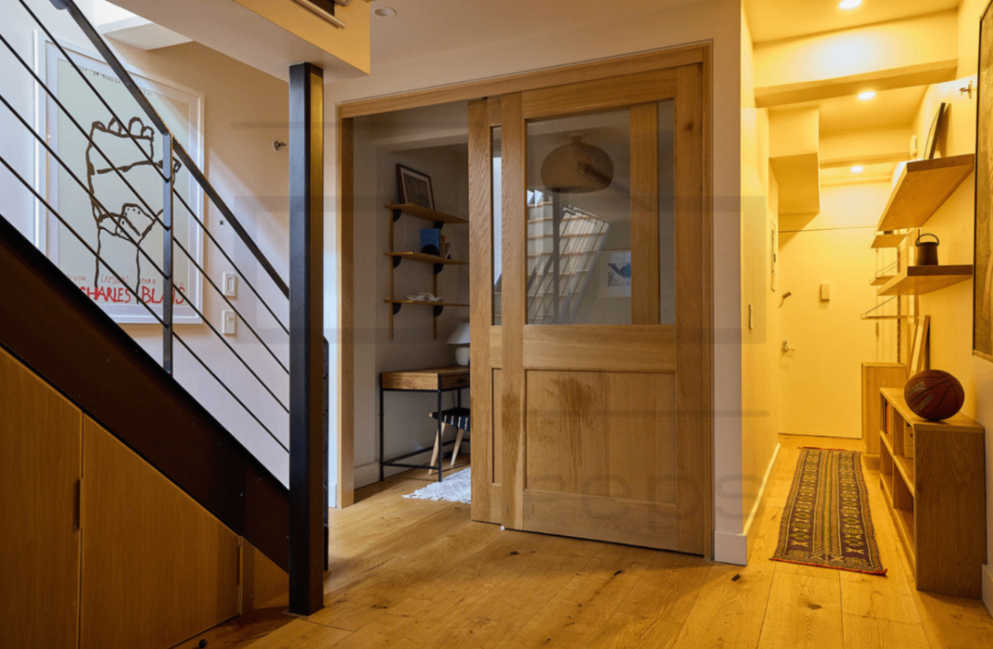 Wide view of severe liquid spill damage on custom luxury millwork before WTS intervention