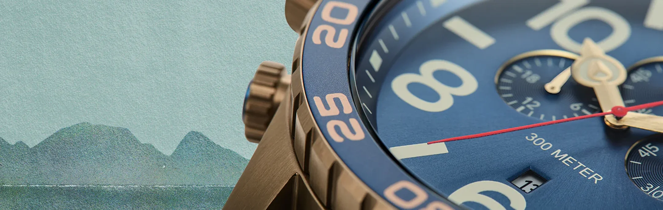 Close-up of a Nixon chronograph watch with blue dial and bronze case against an illustrated mountain backdrop.