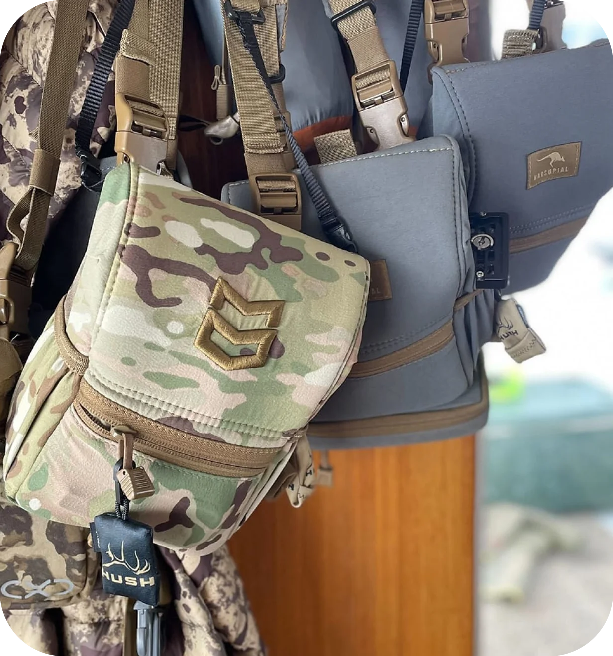 MTN OPS lifestyle photo of camouflage binocular harness packs and hunting gear.