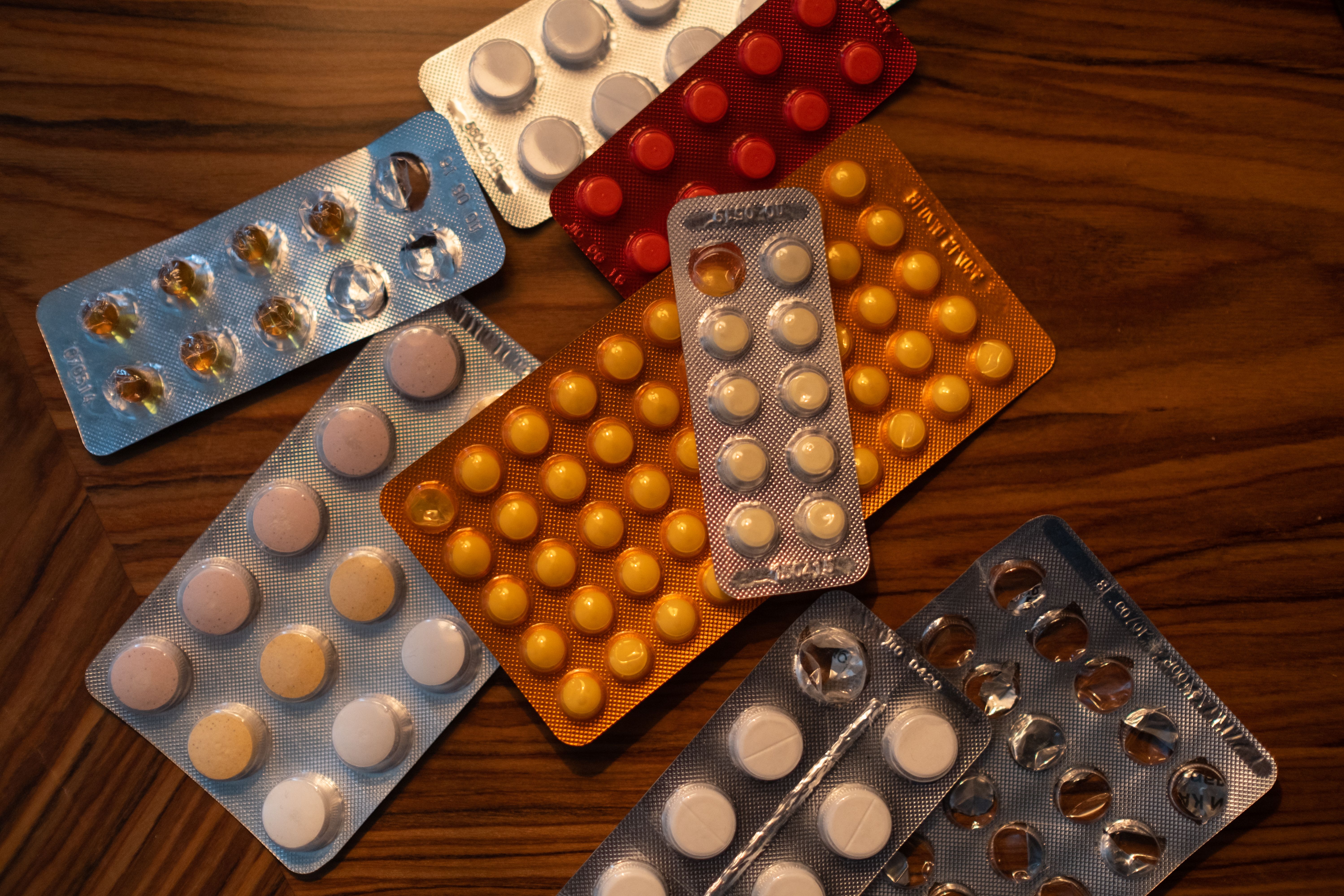 Blister packs of medication arranged on a table