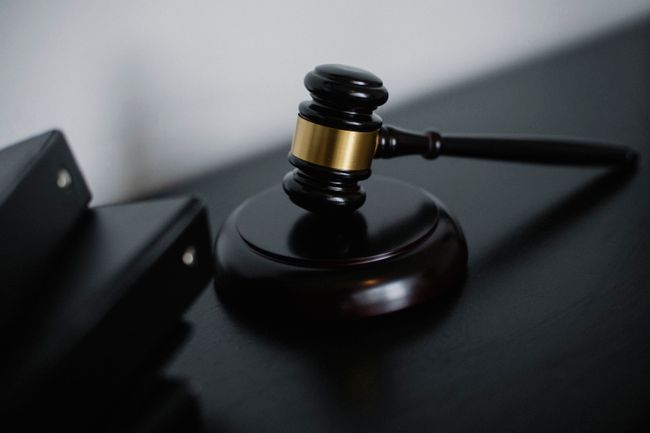 Wooden gavel on a desk representing legal and insurance matters
