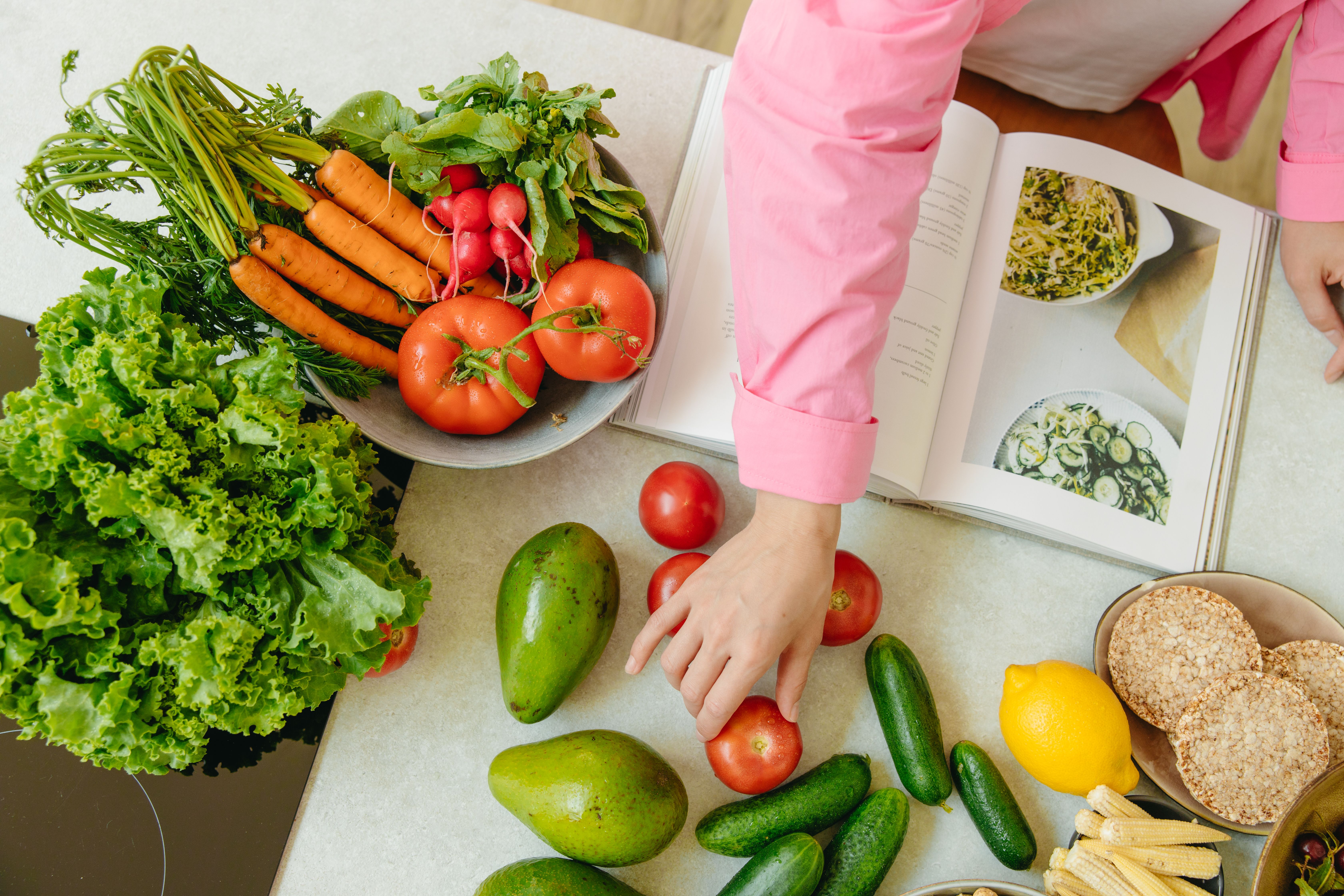 Fresh vegetables and fruits with a recipe book
