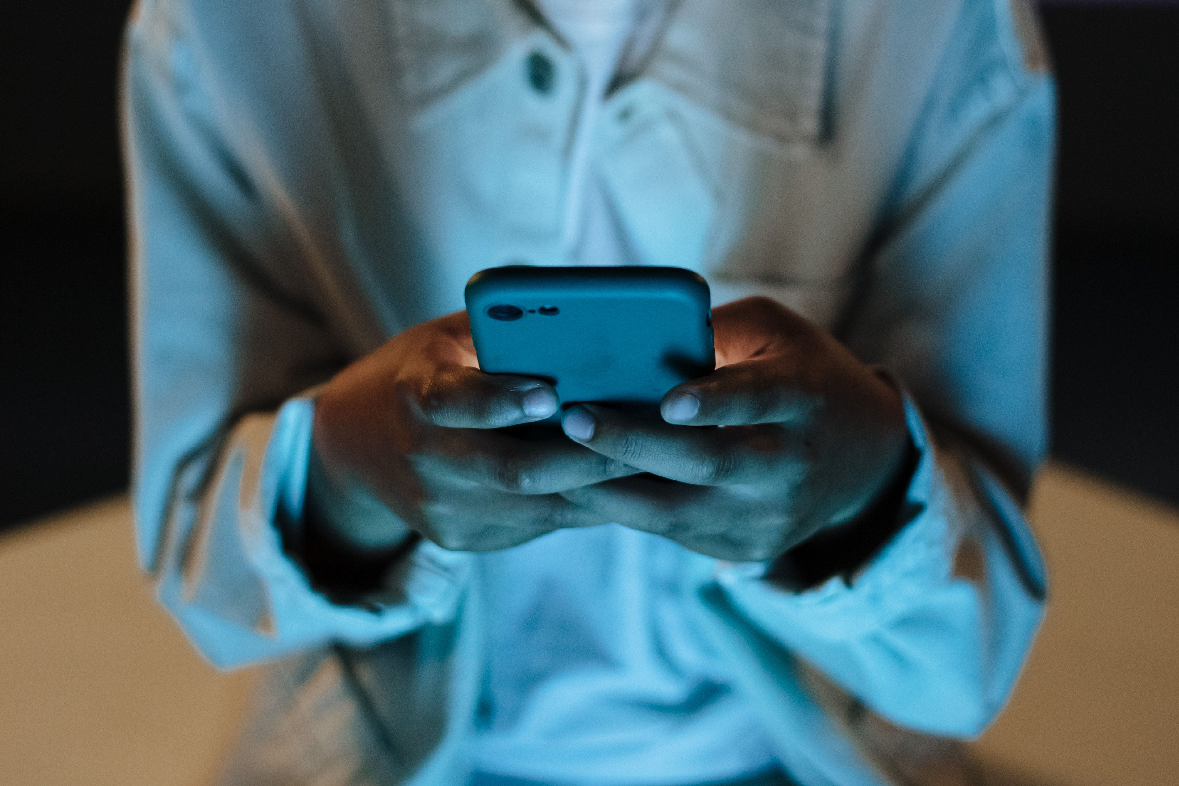 Person using a smartphone at night
