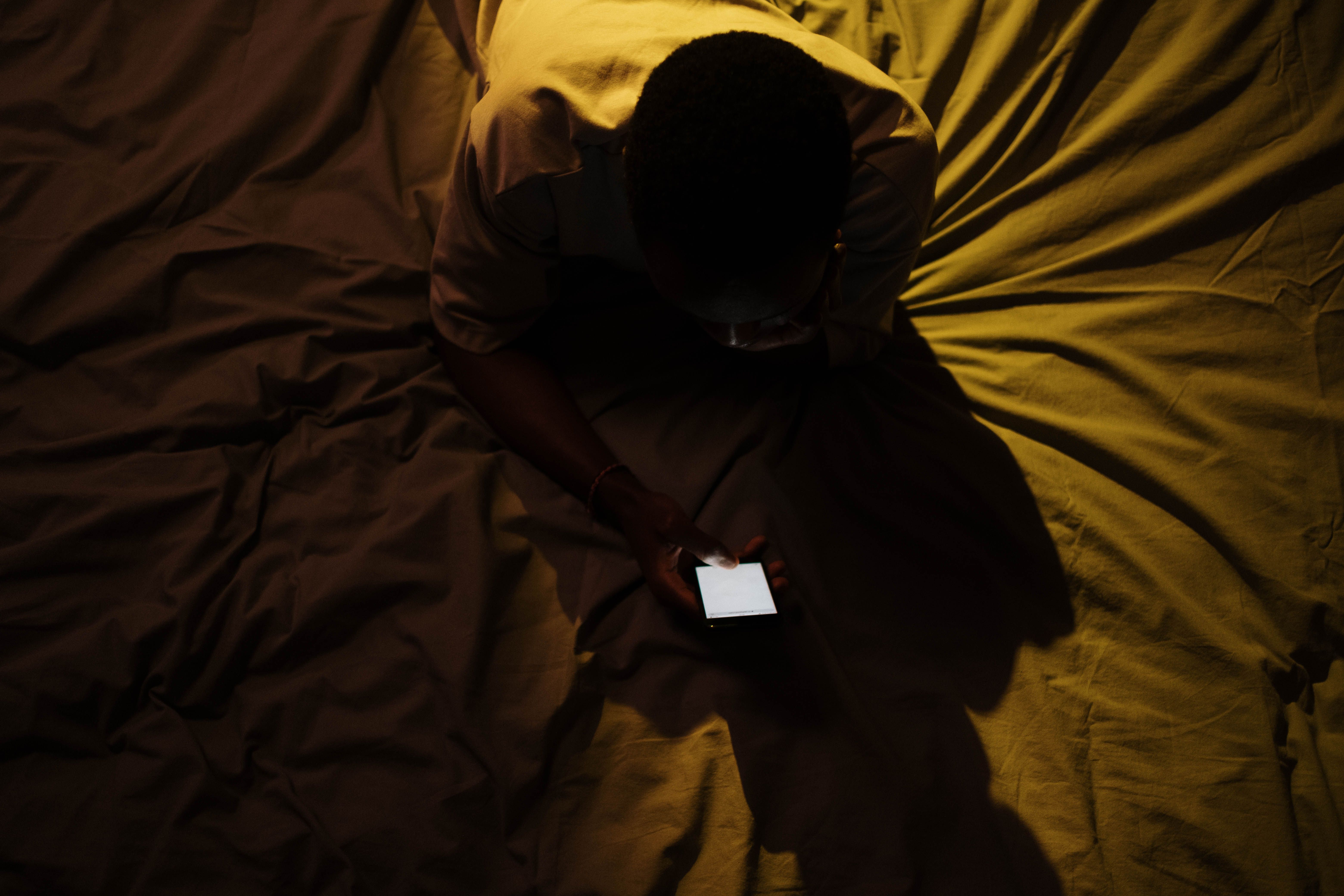 Person using a smartphone late at night