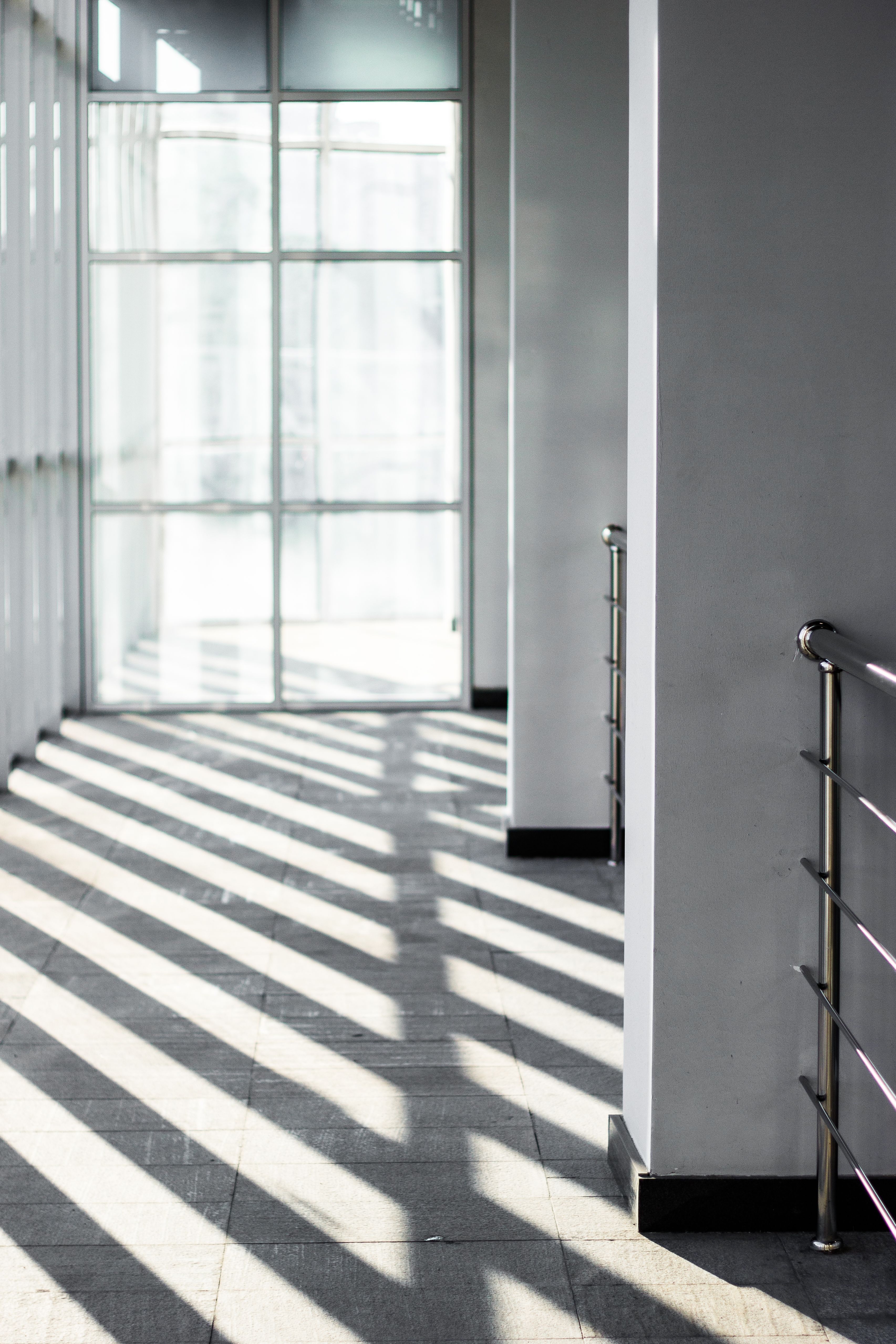 Bright corridor of a modern building with glass walls