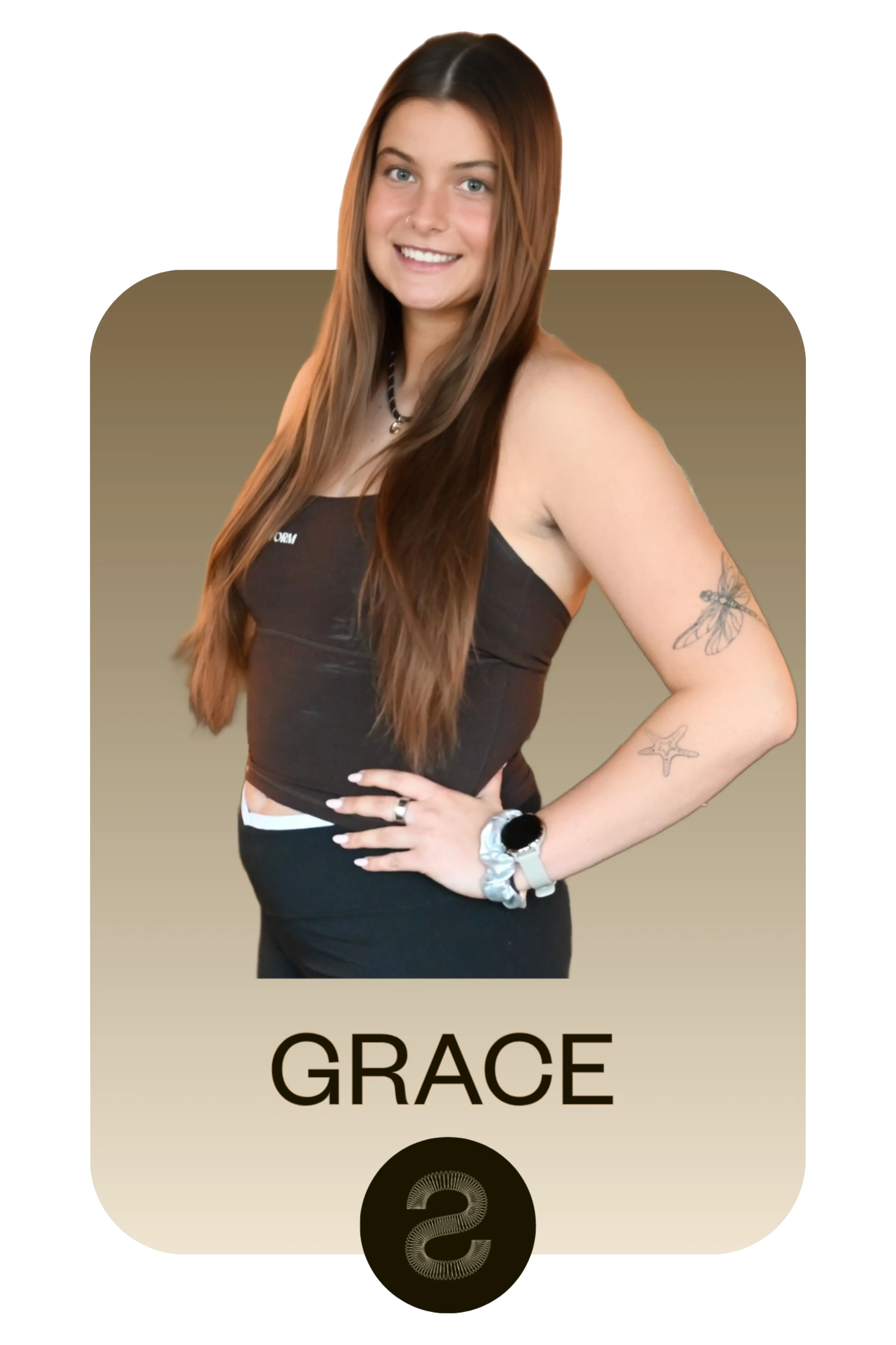 Smiling woman with long brown hair wearing a black tube top and black pants, showing tattoos of a dragonfly and starfish on her arm.