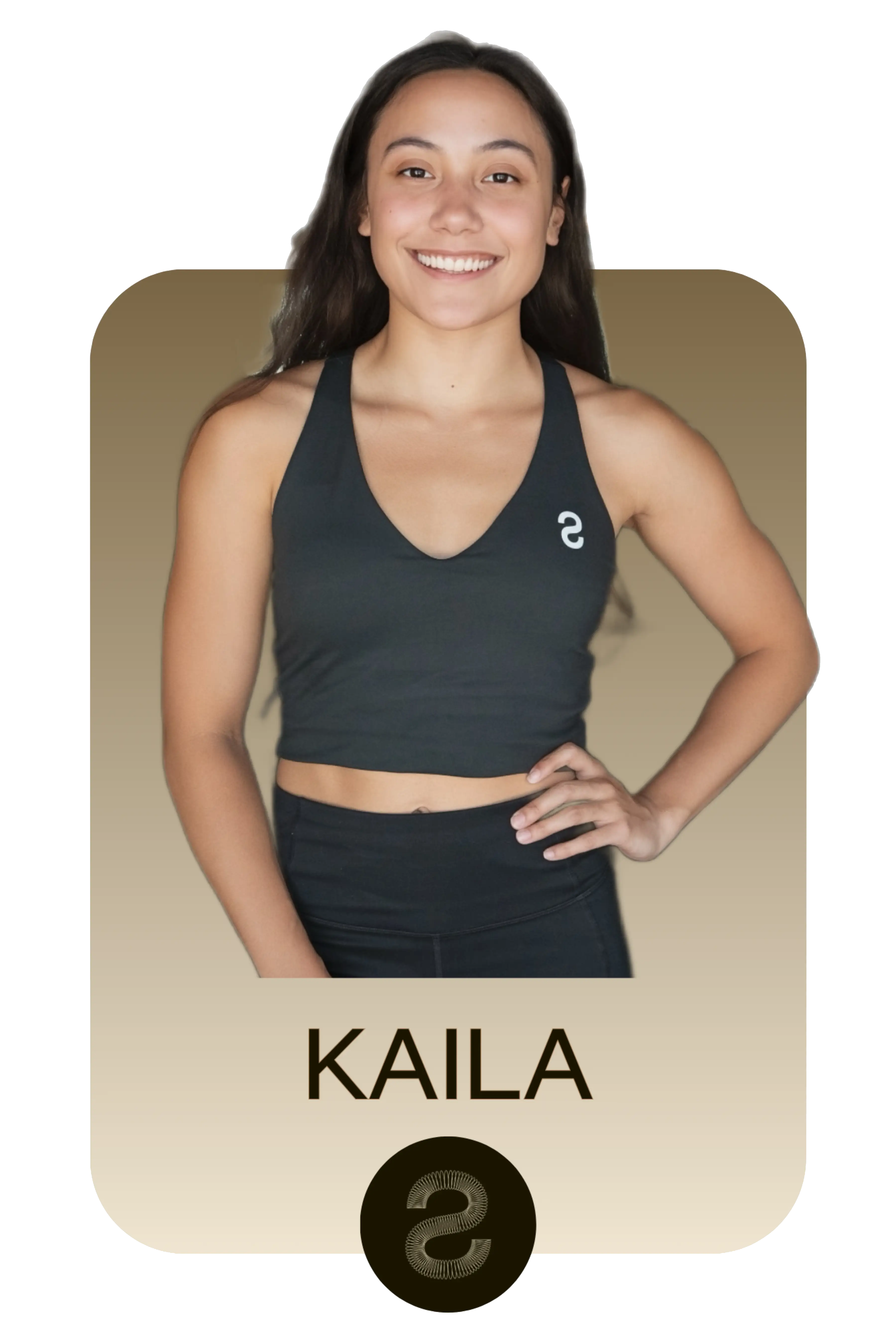 Smiling woman wearing a black sports bra and black leggings standing with one hand on her hip, named Kaila.