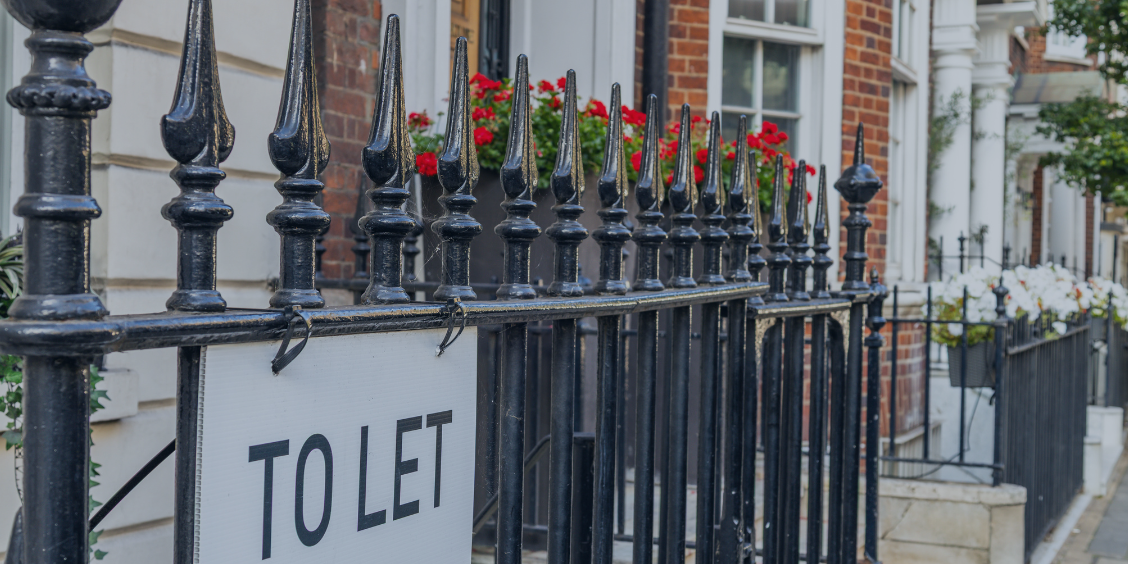 Rails outside london housing with red flower box
