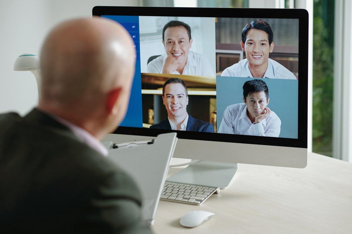 AI-powered deepfake detection analyzing a digital faces for signs of synthetic manipulation during an online meeting.