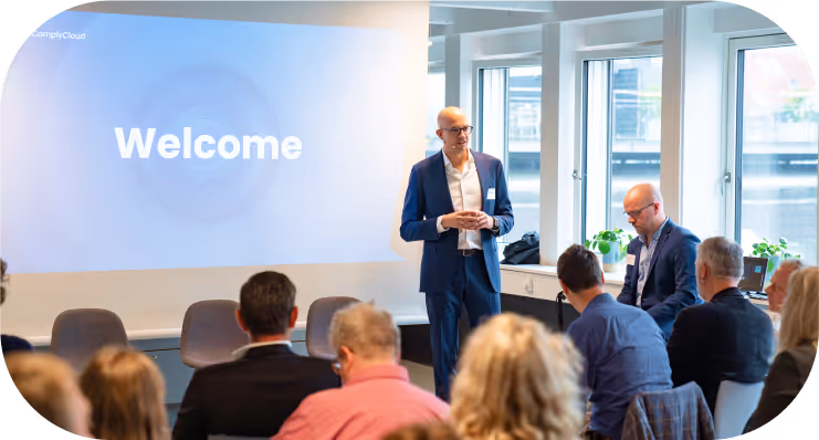 Business speaker addressing an engaged audience at a corporate seminar.