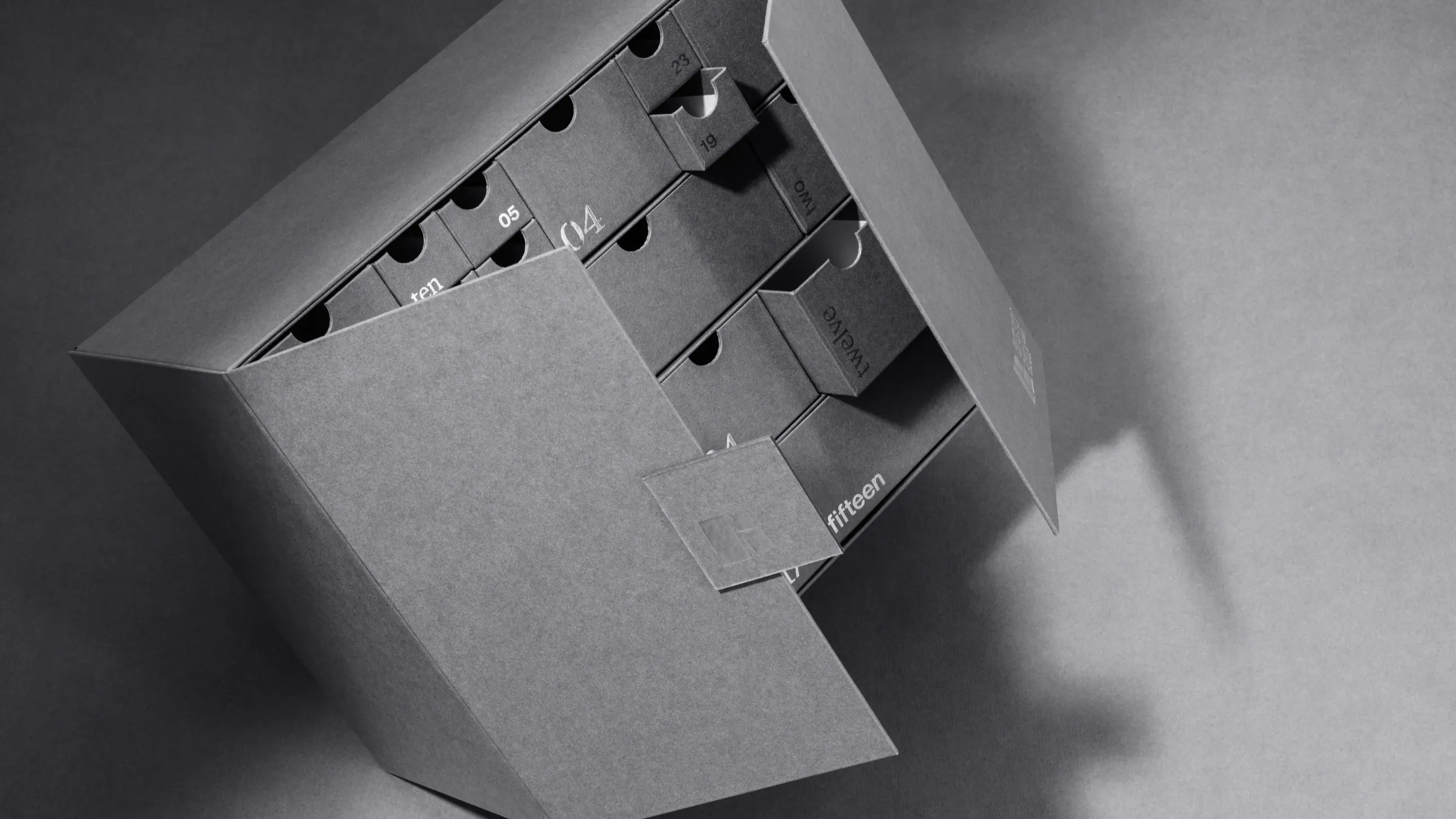 Bigso modern grey cardboard storage unit with numbered pull-out drawers, designed for organized home and office storage solutions.