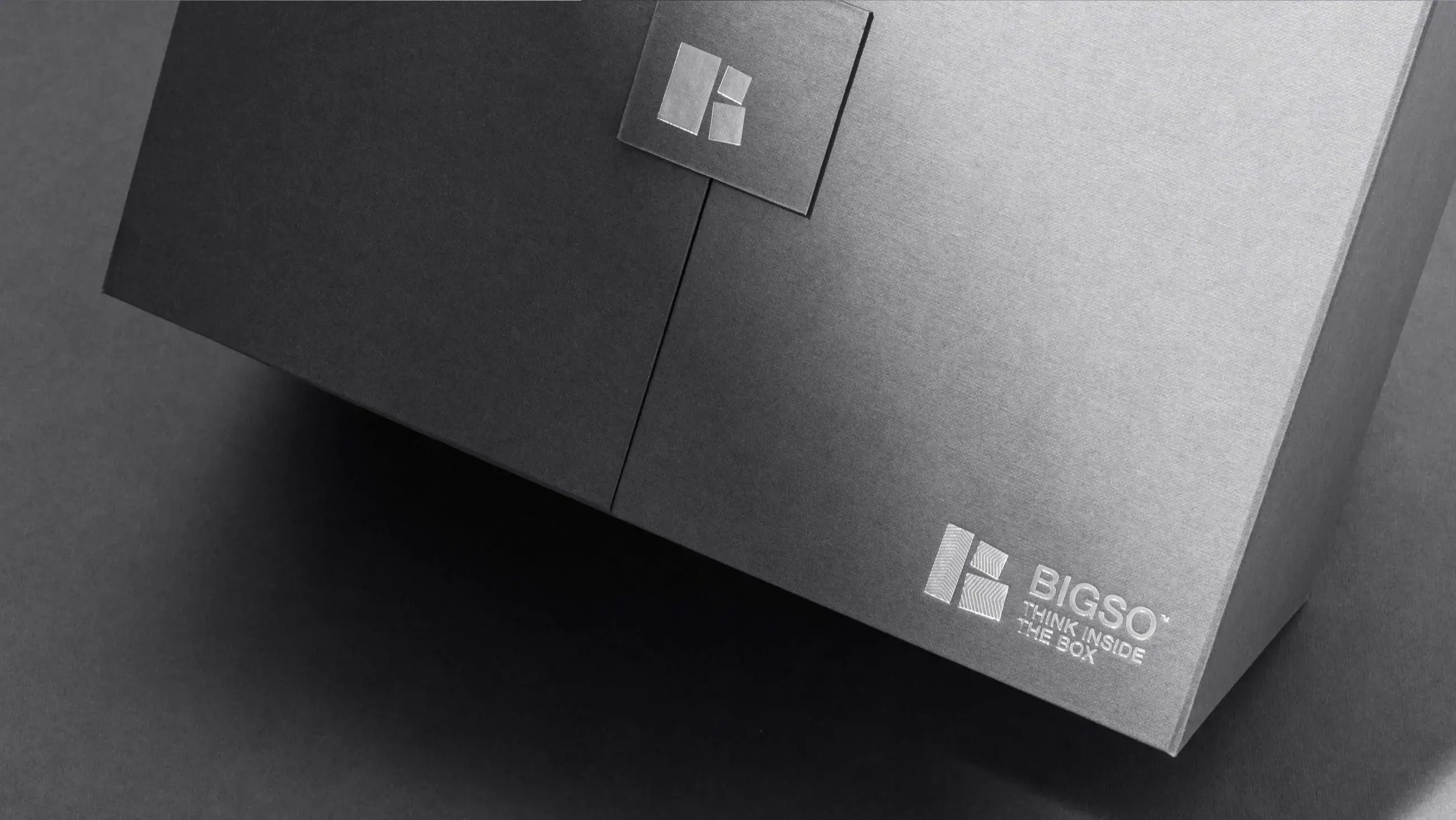 Close-up of premium matte black Bigso storage box with silver logo and magnetic flap closure, showcasing luxury minimalist packaging design.