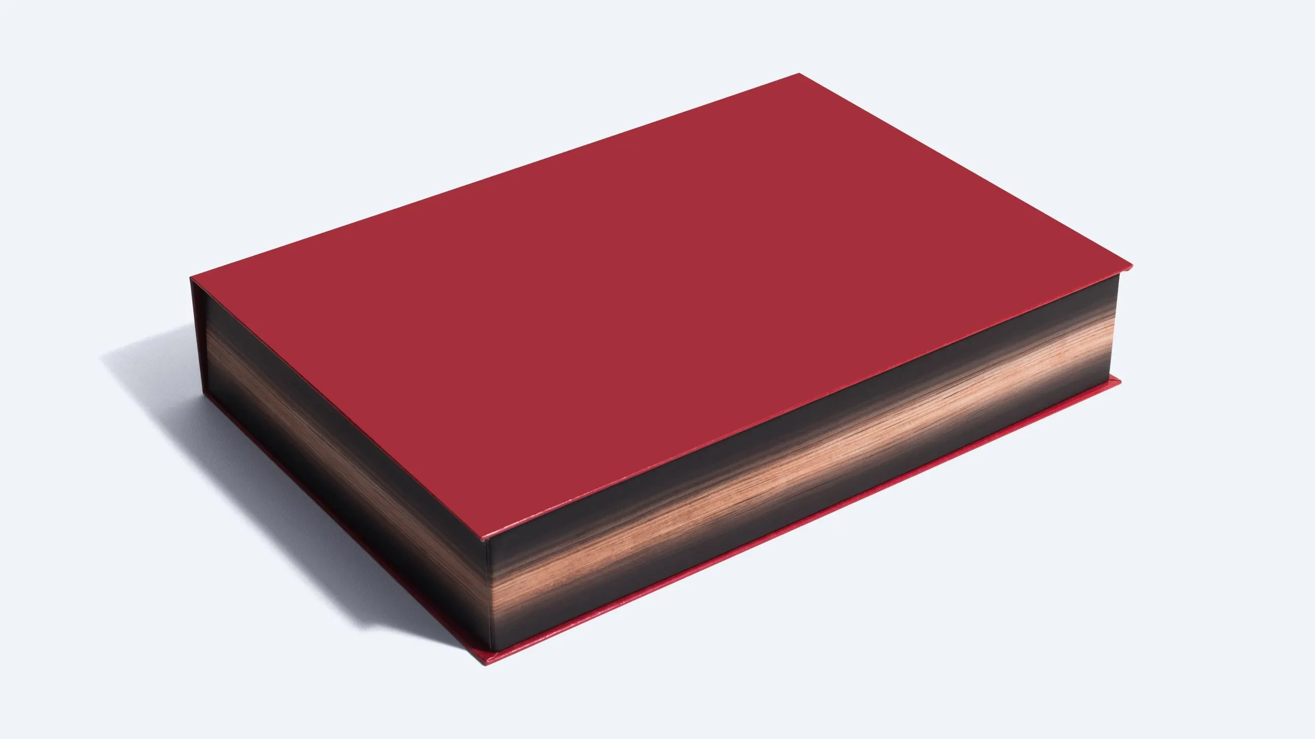 A luxury packaging box designed to look like a book, with a hinged lid for secure closure.