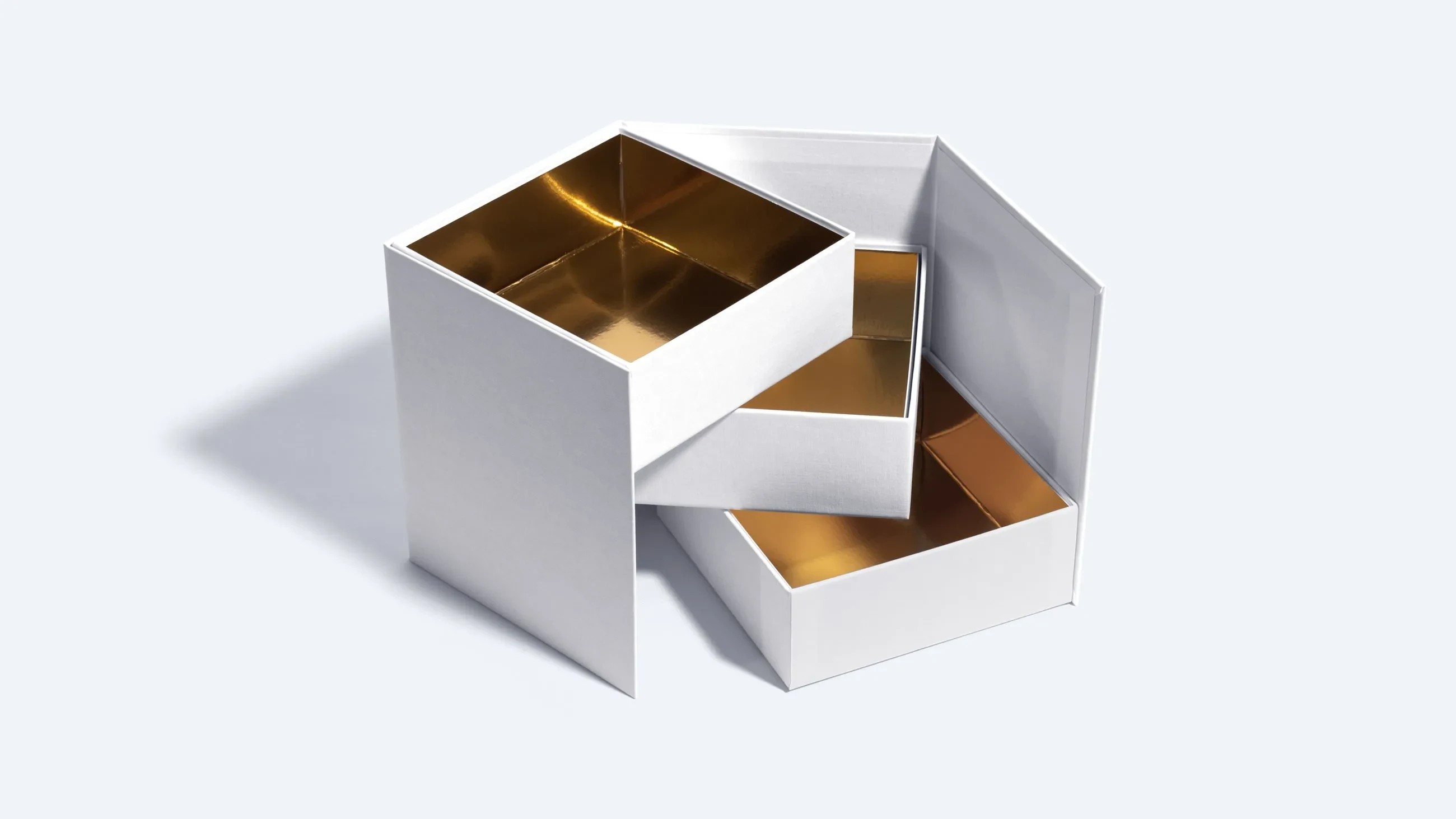 White transformer rigid box with metallic gold-lined compartments partially unfolded.