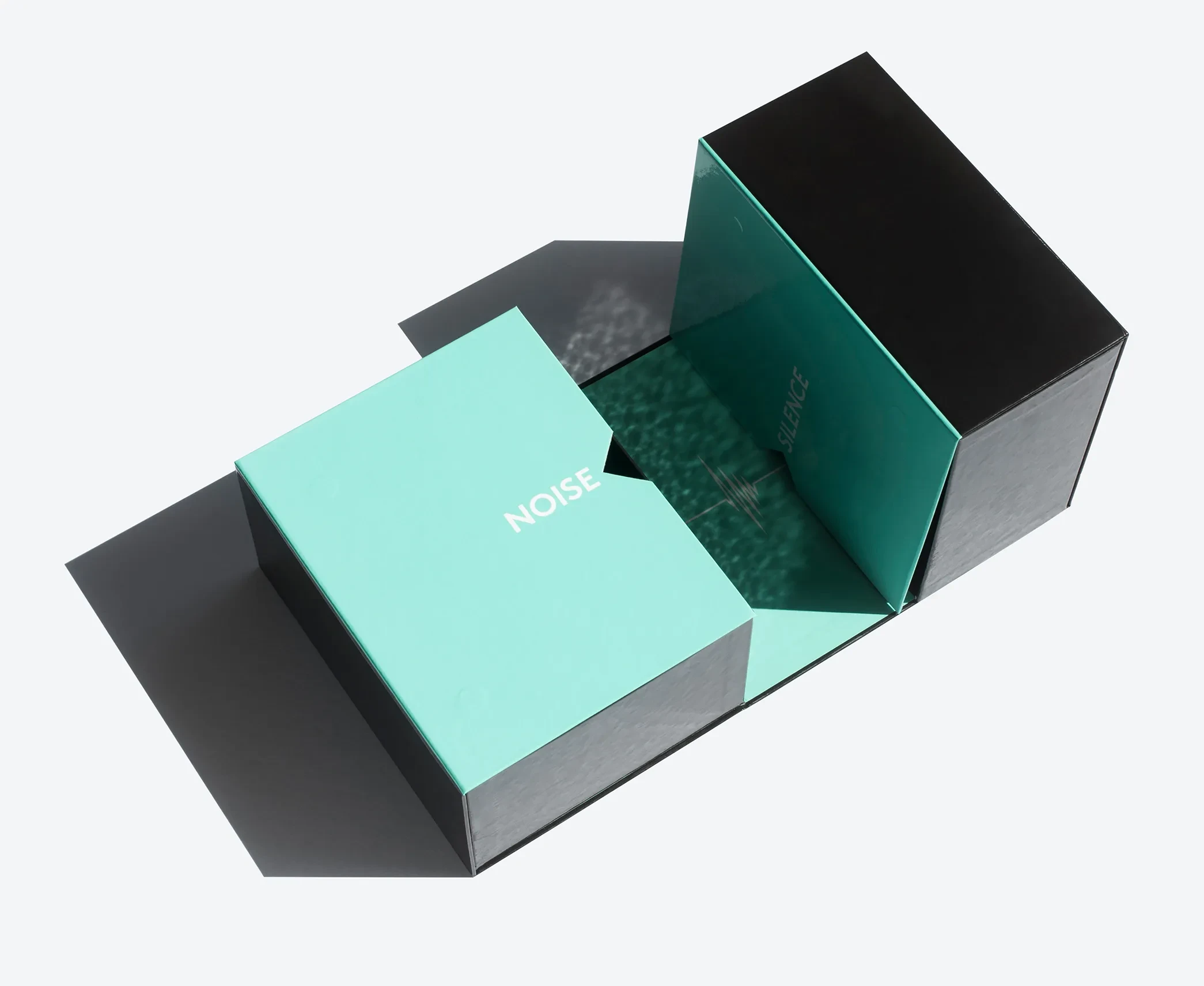 The same transformer rigid box, viewed from above, showing its folding compartments labeled “Noise” and “Silence.”