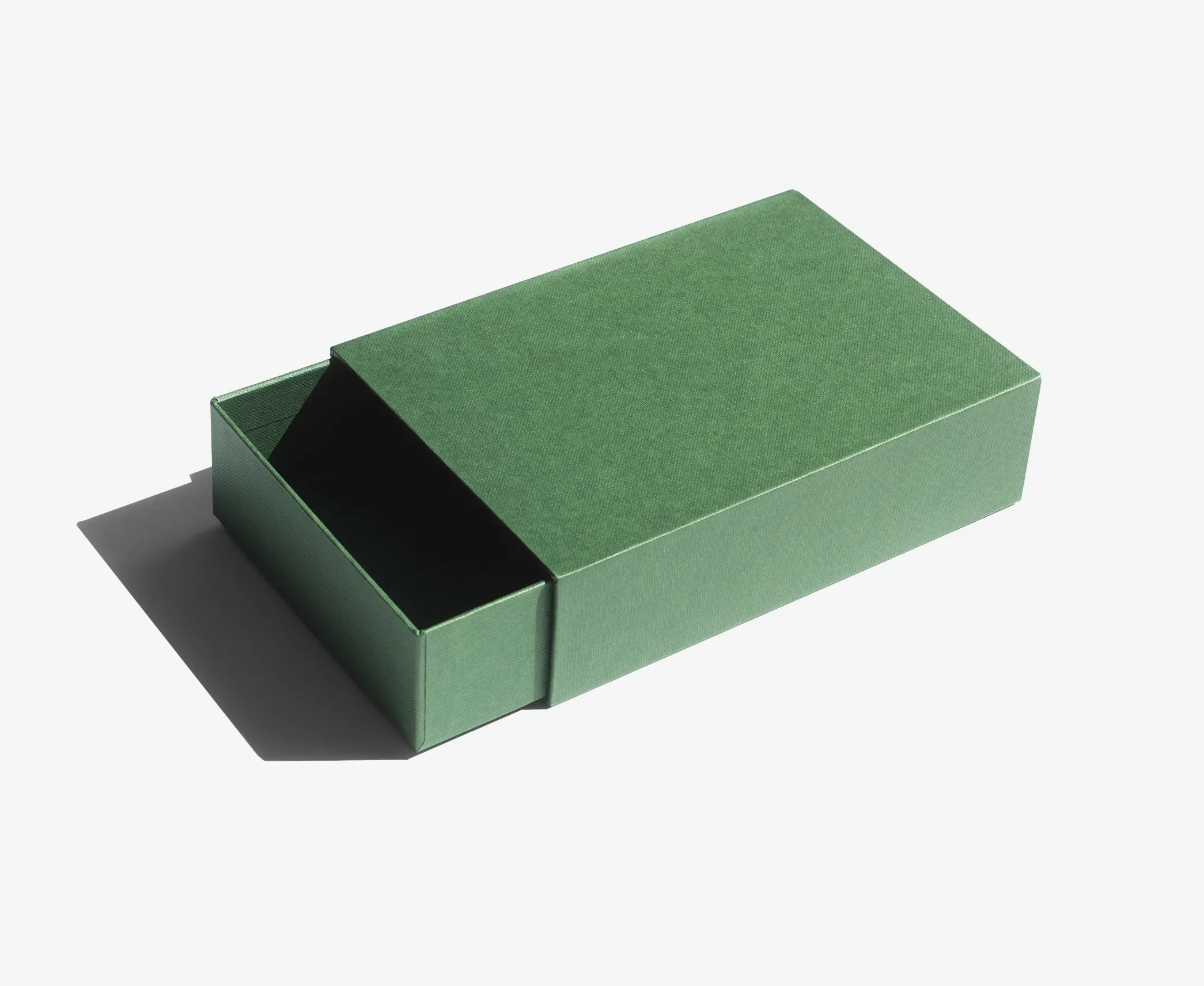 A green rigid drawer box with the inner compartment slightly opened, styled in a minimalist design.