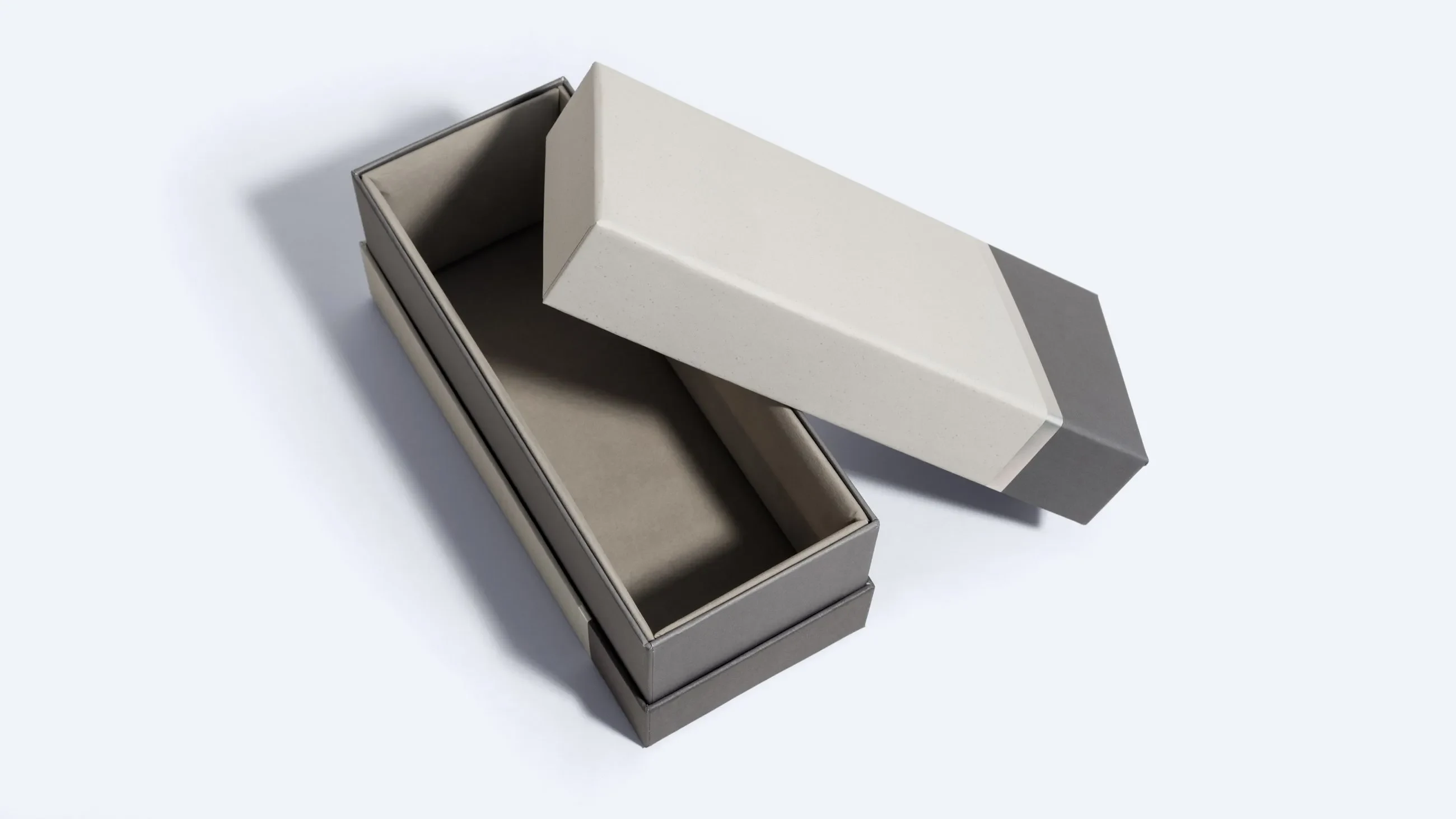 Rectangular grey and beige neck box – A rectangular rigid neck box in grey with a beige lid, shown with the lid lifted to reveal the shoulder structure.