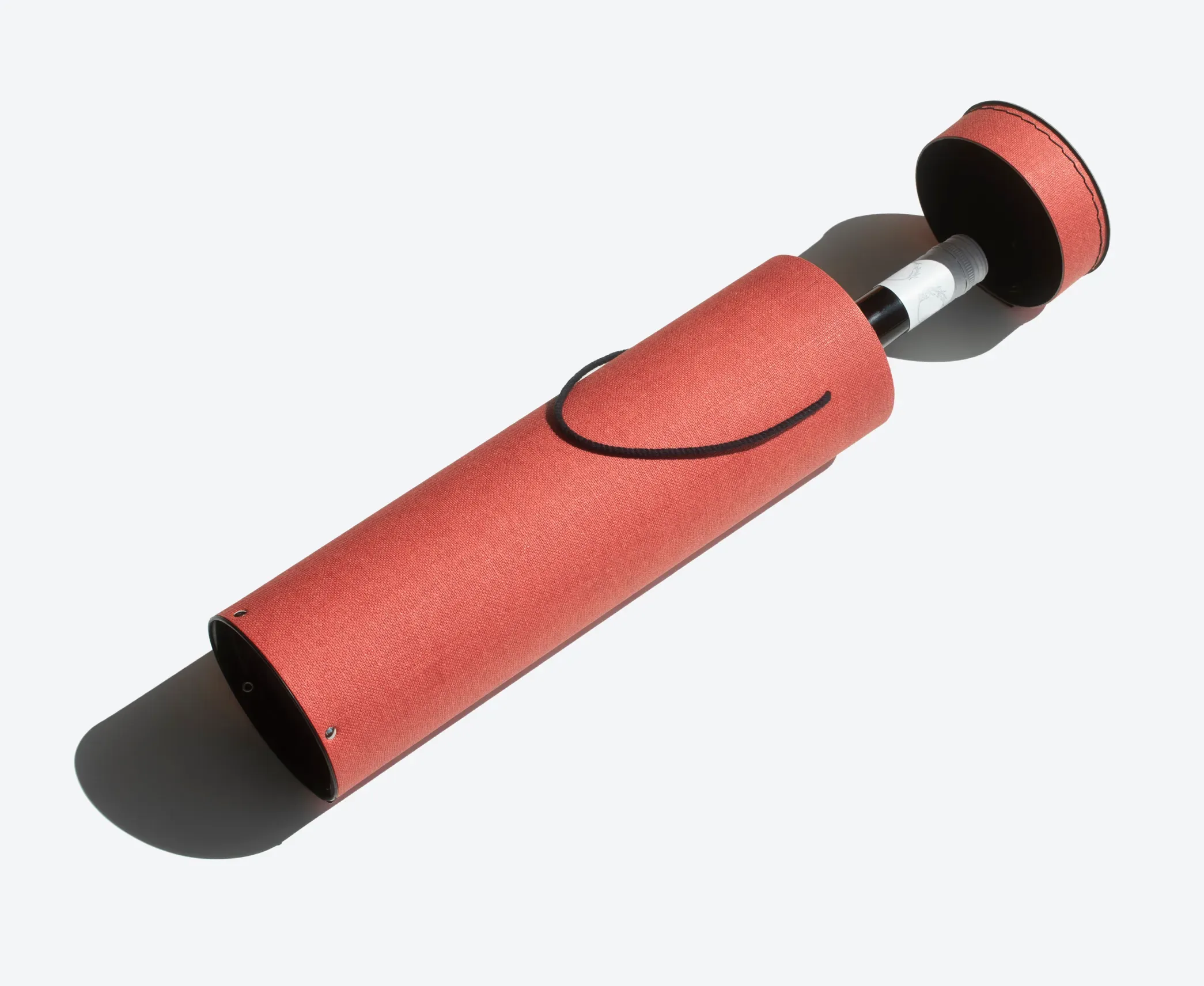 Wine Bottle Round Rigid Box – Tall red cylindrical box with rivets and handle, crafted for secure storage and luxury wine gifting.