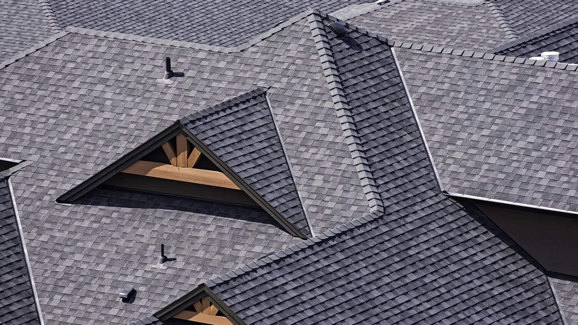Architectural asphalt shingle roofing system installed on a residential home for long-term weather protection