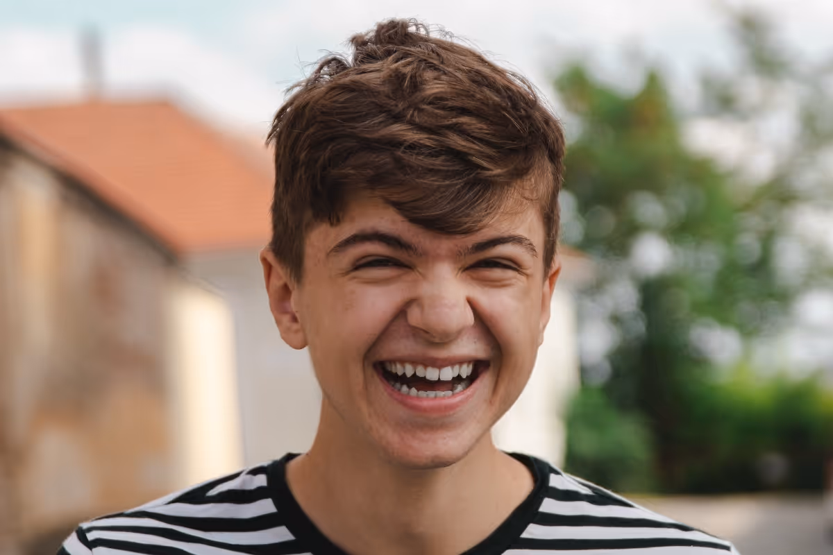 teenage boy laughing
