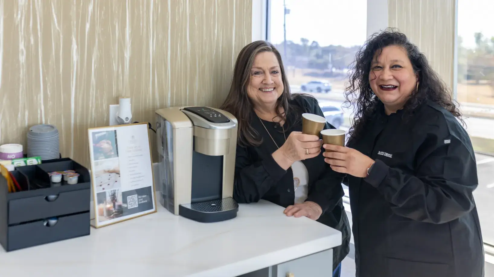 Dazzle Dental team members drinking coffee