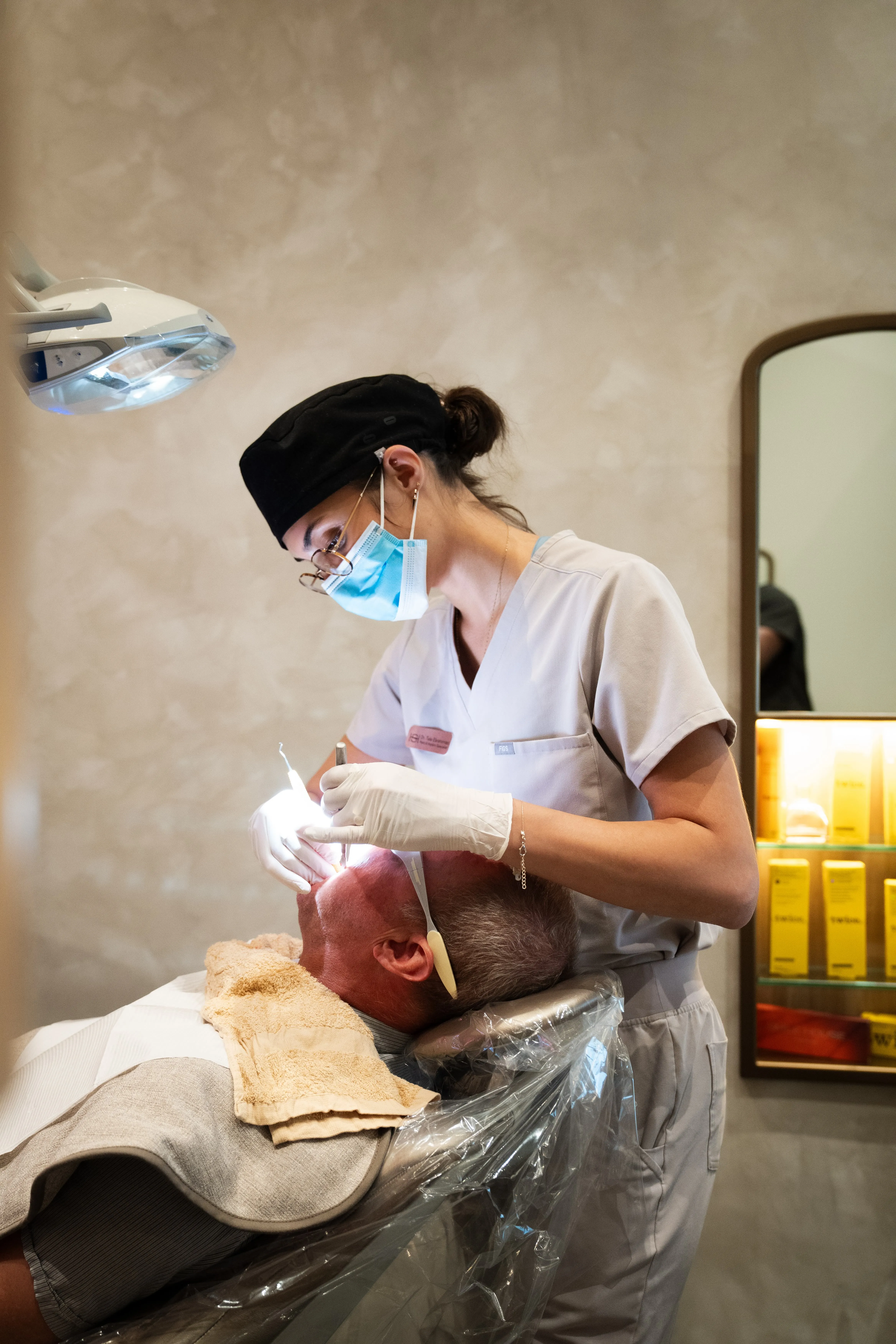 Smile House hygienist treating a patient in a warm plaster treatment room