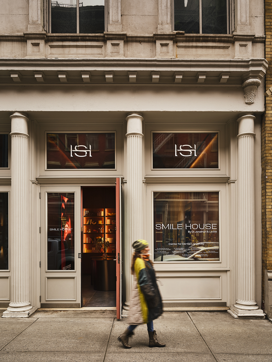 Smile House Tribeca storefront with fluted columns and the HSH monogram