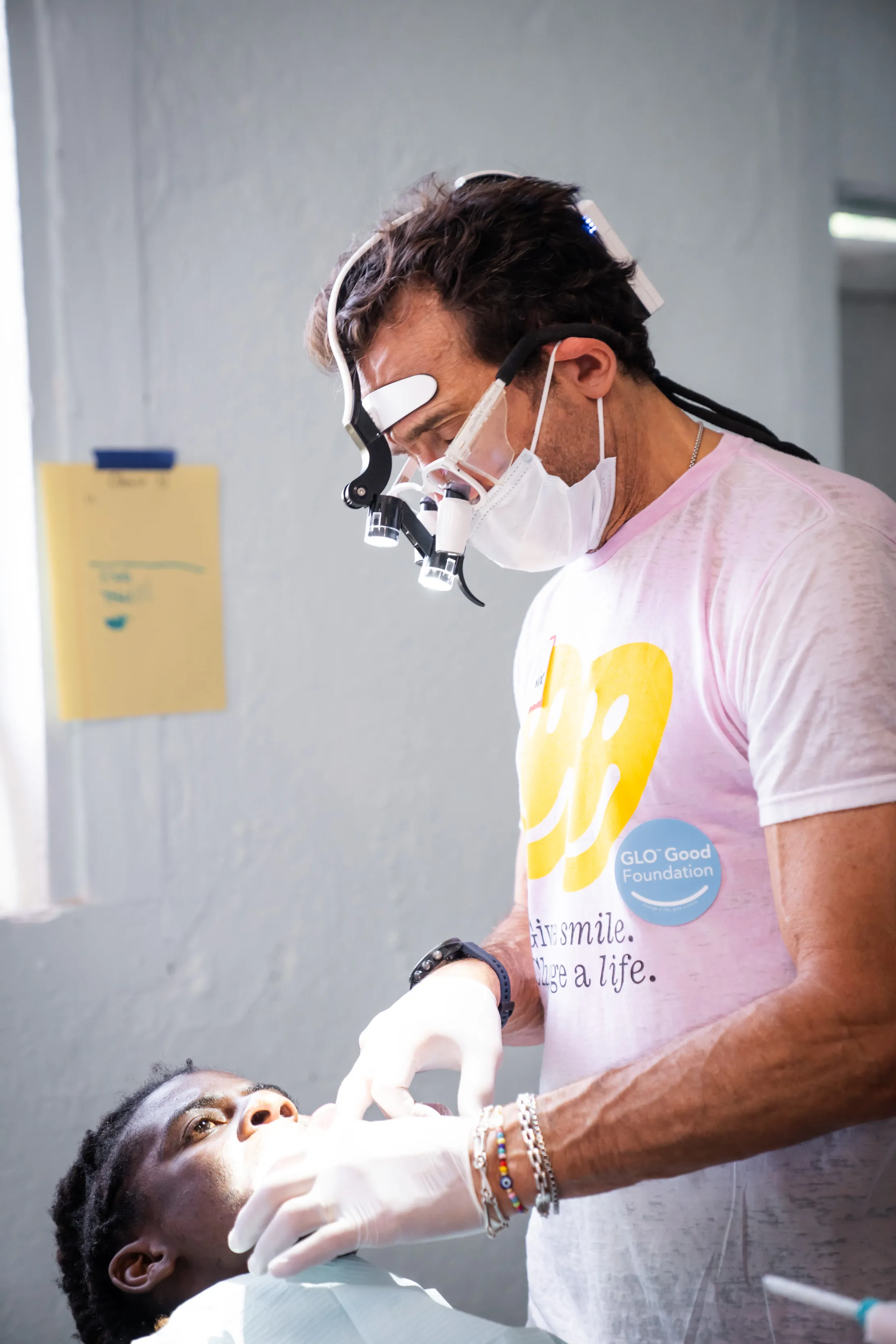 Dr. Jonathan B. Levine treating a patient on a GLO Good Foundation mission