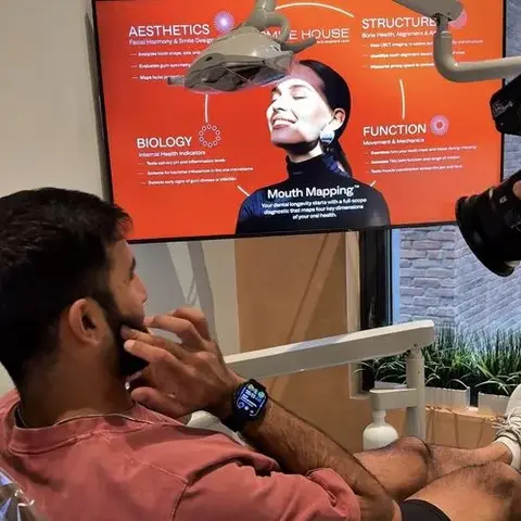 A Smile House patient reviewing Mouth Mapping results on screen