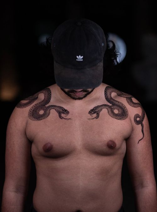 The snake has been tattooed on human skin for thousands of years — longer than almost any other subject in body art. It shows up in ancient Egypt, in Greek mythology, in Japanese folklore, in indigenous traditions across every continent. That kind of staying power doesn't happen by accident. Something about the snake speaks to something deep. This guide breaks down what snake tattoos actually mean, the different cultural traditions behind them, and the design directions worth considering.