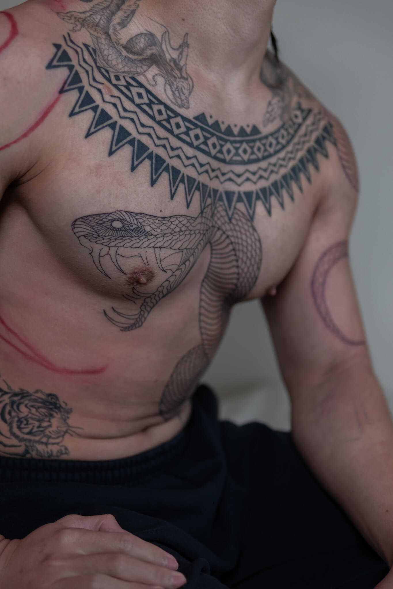 The snake has been tattooed on human skin for thousands of years — longer than almost any other subject in body art. It shows up in ancient Egypt, in Greek mythology, in Japanese folklore, in indigenous traditions across every continent. That kind of staying power doesn't happen by accident. Something about the snake speaks to something deep. This guide breaks down what snake tattoos actually mean, the different cultural traditions behind them, and the design directions worth considering.