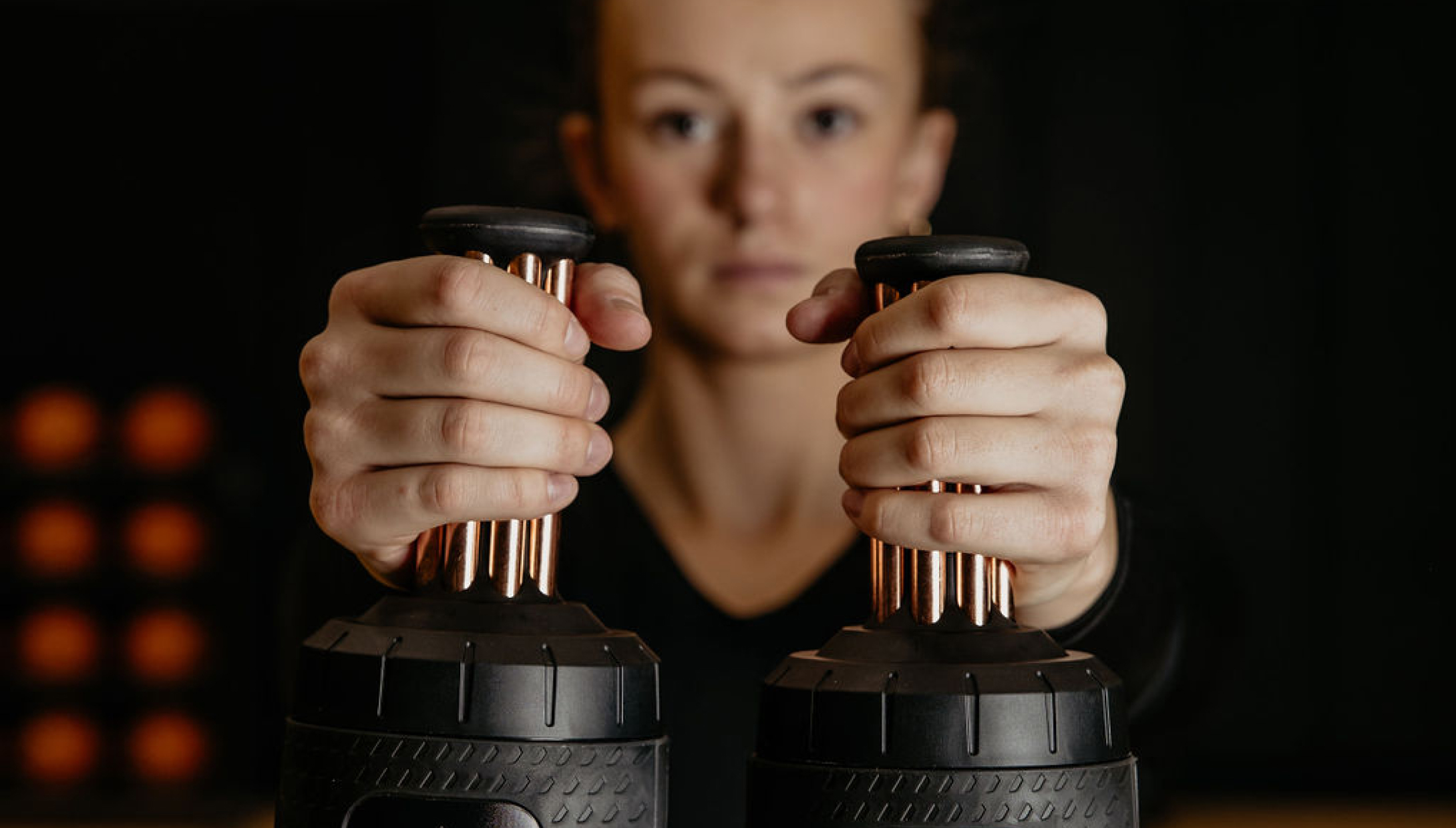 Basketball player holds Narwhals, a recovery device for athletic performance