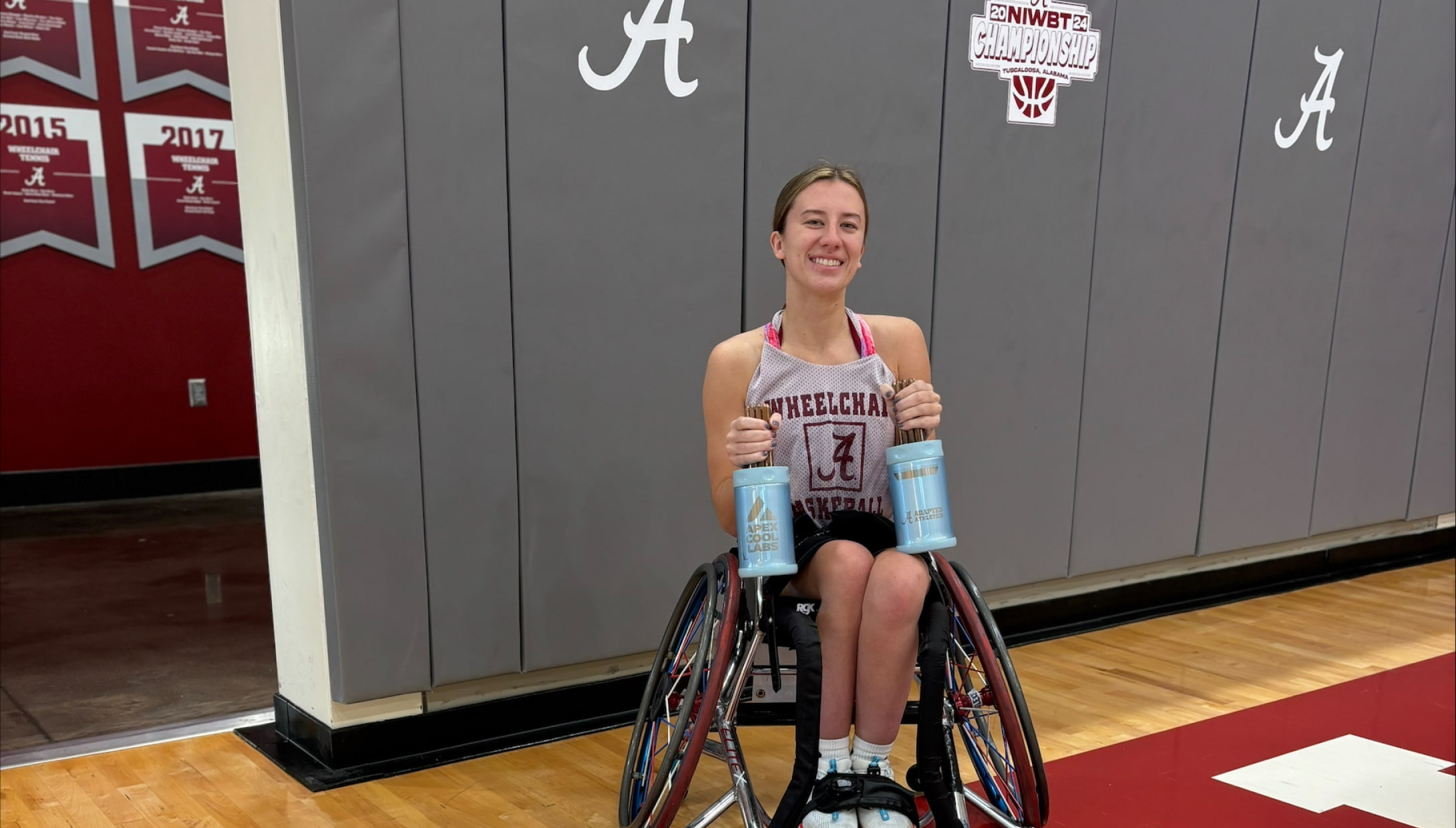 Abby Bauleke, silver medalist in wheelchair basketball at the Paris Paralympics, holds the Narwhals, a palm cooling device for in-game recovery