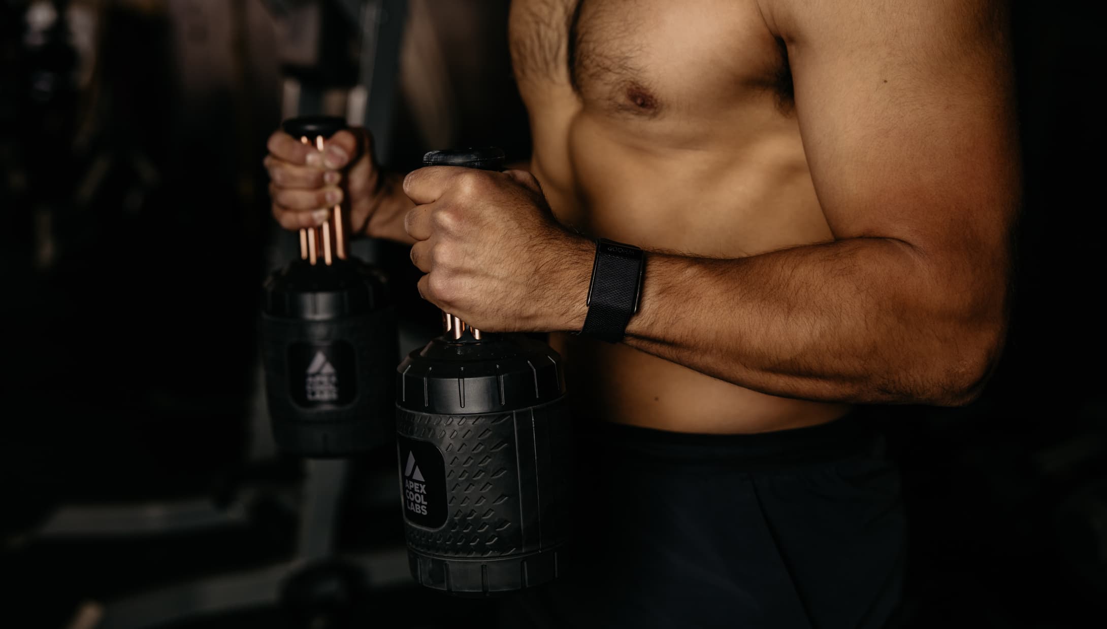 An athlete holds a palm cooling device called the Narwhals by Apex Cool Labs