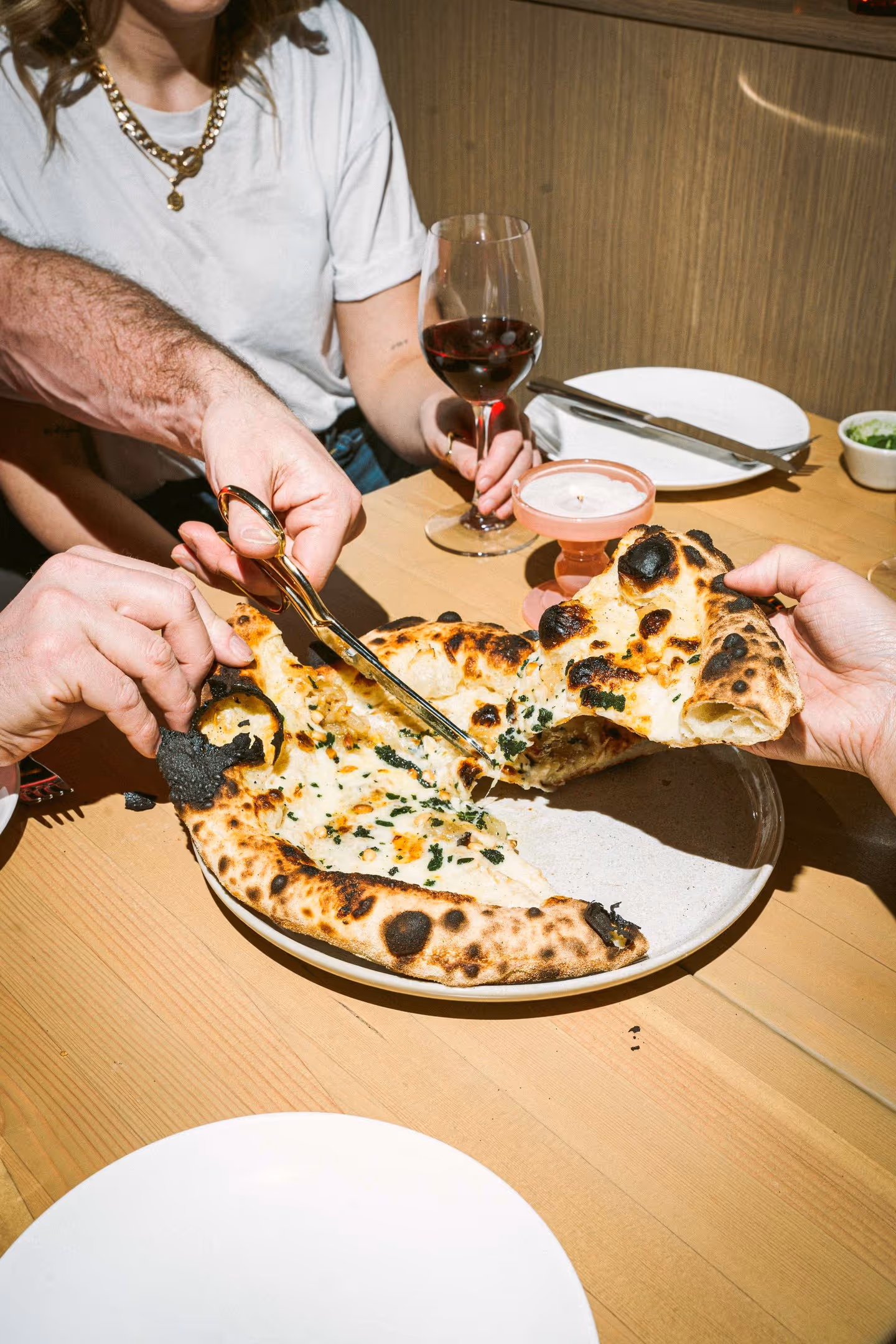 Who needs a pizza cutter when you’ve got good friends and sharp scissors?