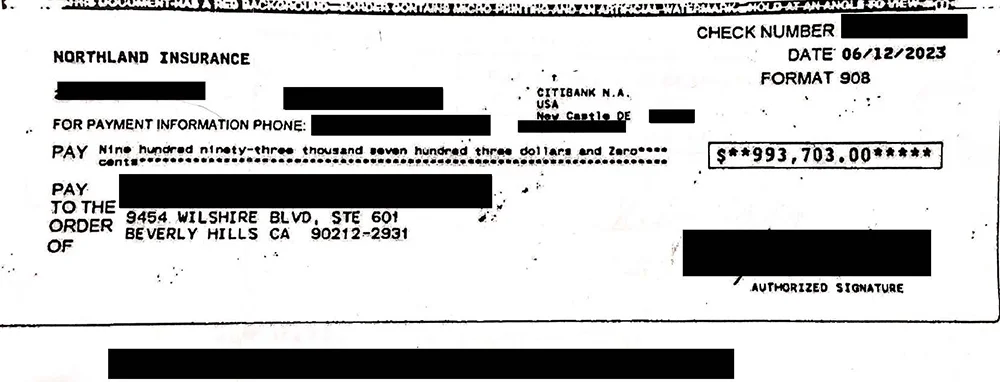 A settlement check for $993703