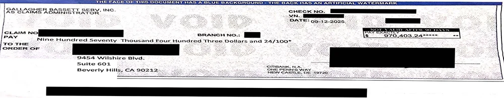 A settlement check for $970,403