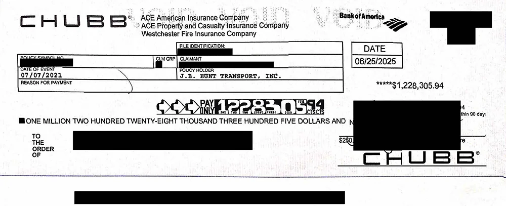 A settlement check for $1,228,305