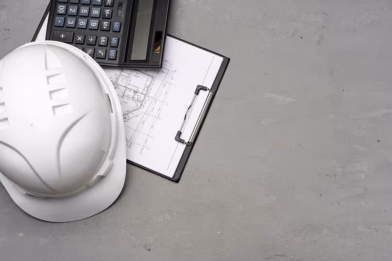architect-tools-hardhat-blueprints-and-calculator